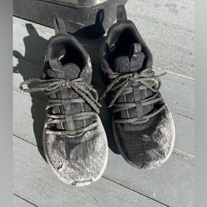 Women’s Worn Distressed Black Puma Sneakers
